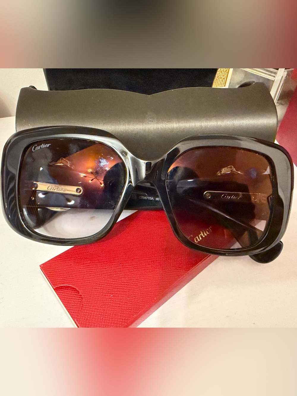 Cartier Black Frame Sunglasses with Brown Gradient Lenses